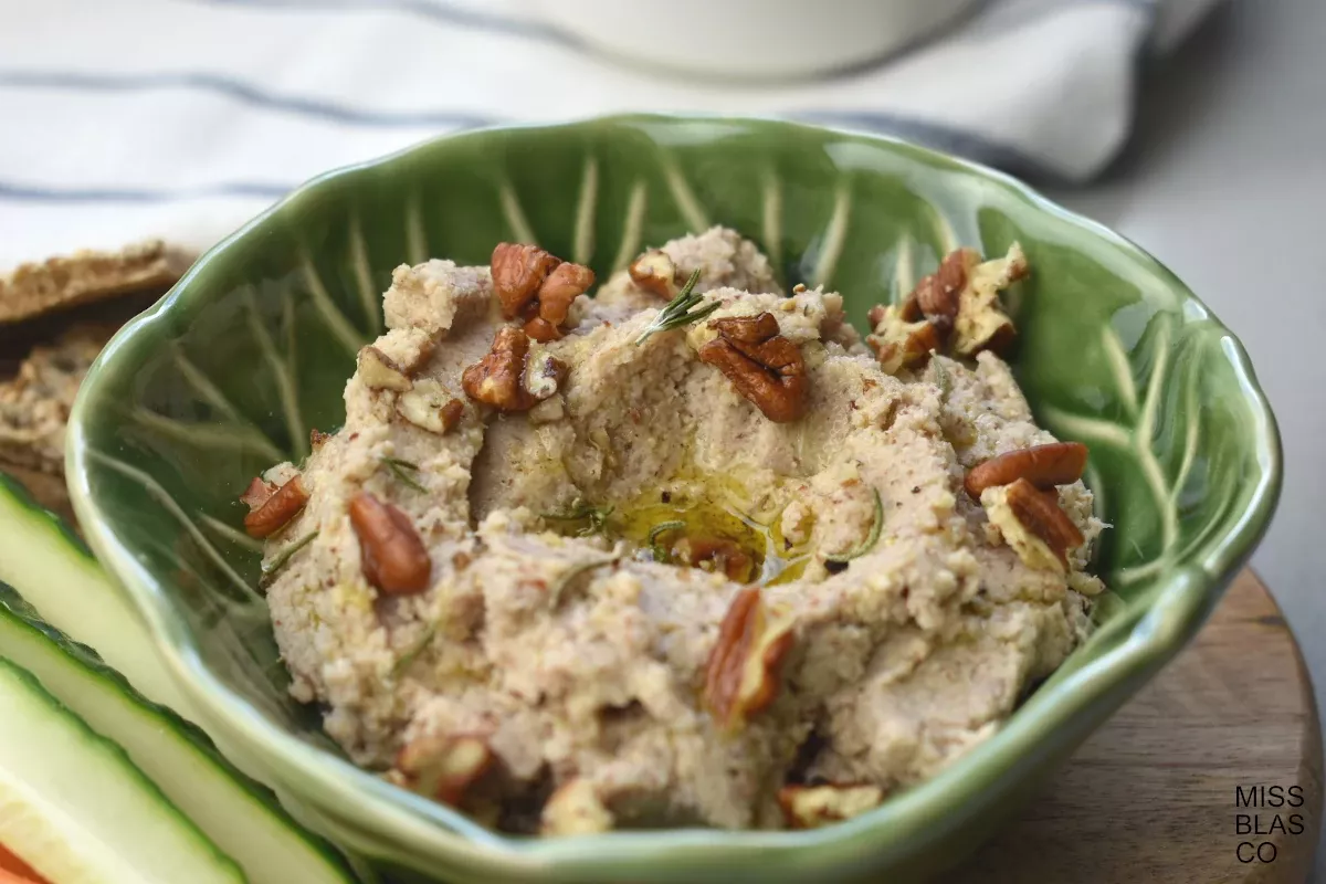 Roasted cauliflower and pecan dip in a green bowl