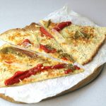 cawliflower pizza on a board