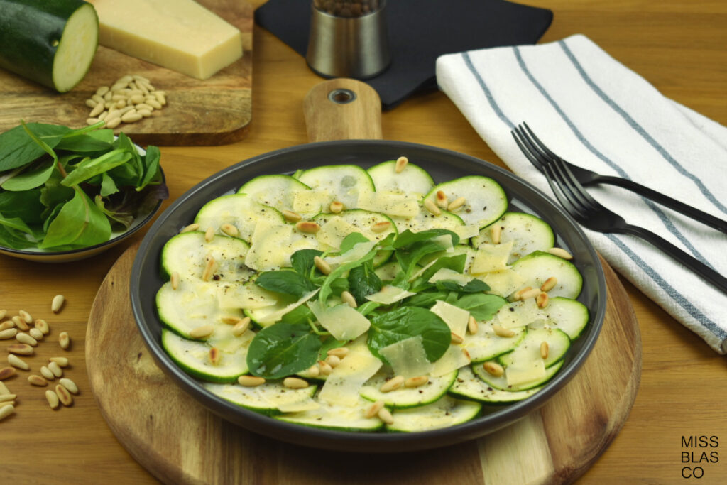 low calorie zucchini carpaccio with pinuts and parmesan cheese