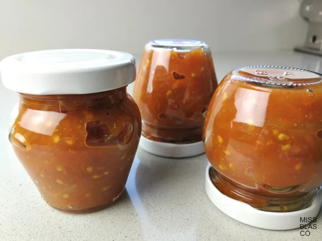tomato chutney in glass jars