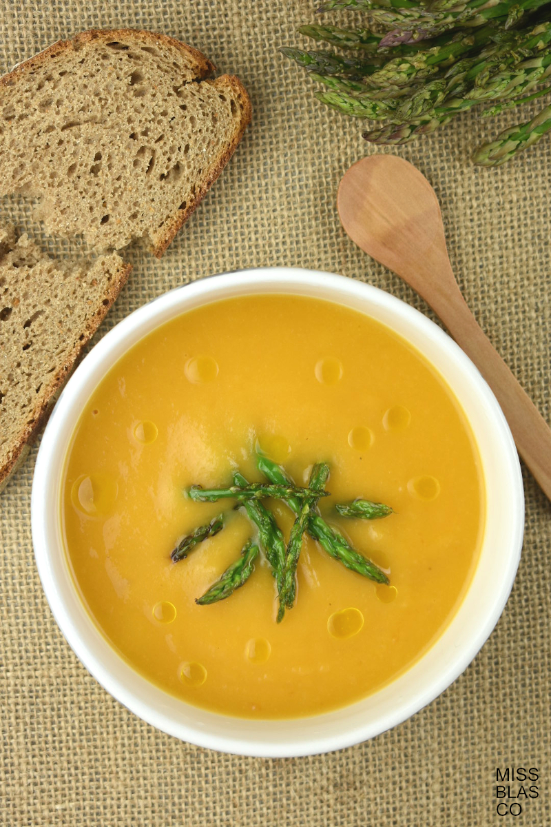 Pumpkin Apple Soup with green asparagus and rye bread